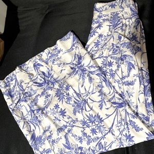 Flowy white pants with blue palm trees.